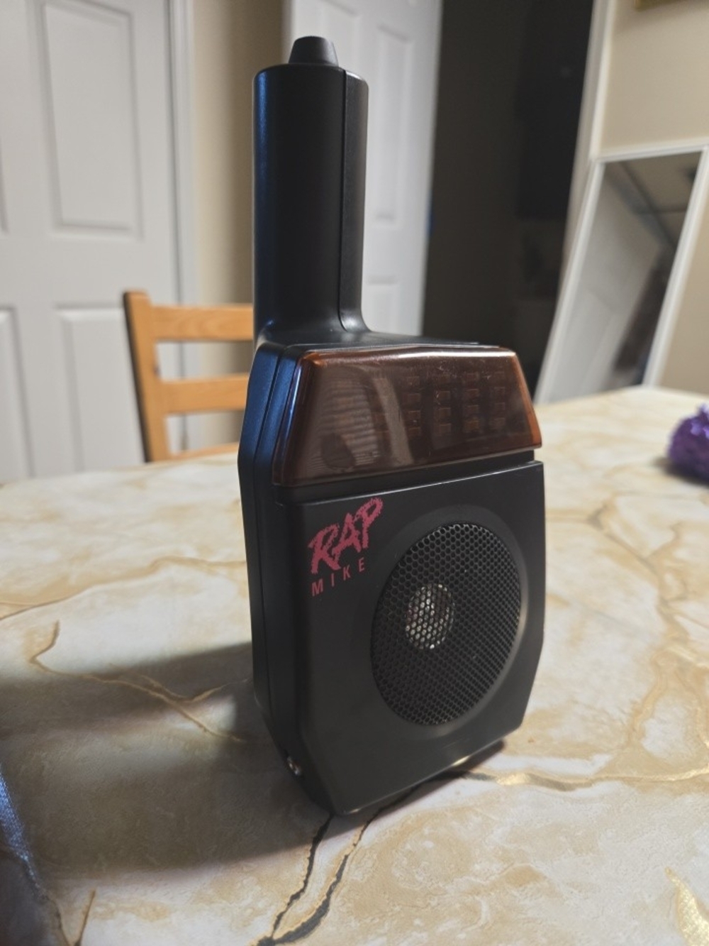 Compact Black Portable Two-Way Radio with Amber Accent